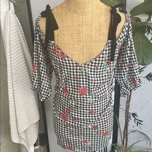 Elegant Black and White Checkered Blouse with Floral Accents